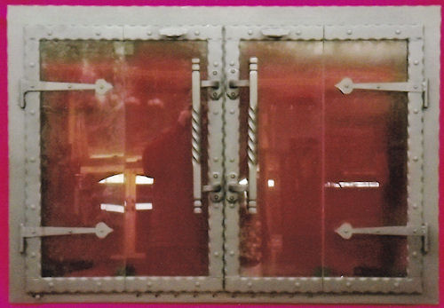 Blacksmith Deluxe Black finish, bi foldÂ hammered steel door with barn strap hinges, rivets, viceÂ Â  & Camelot handles, standard smoke glas